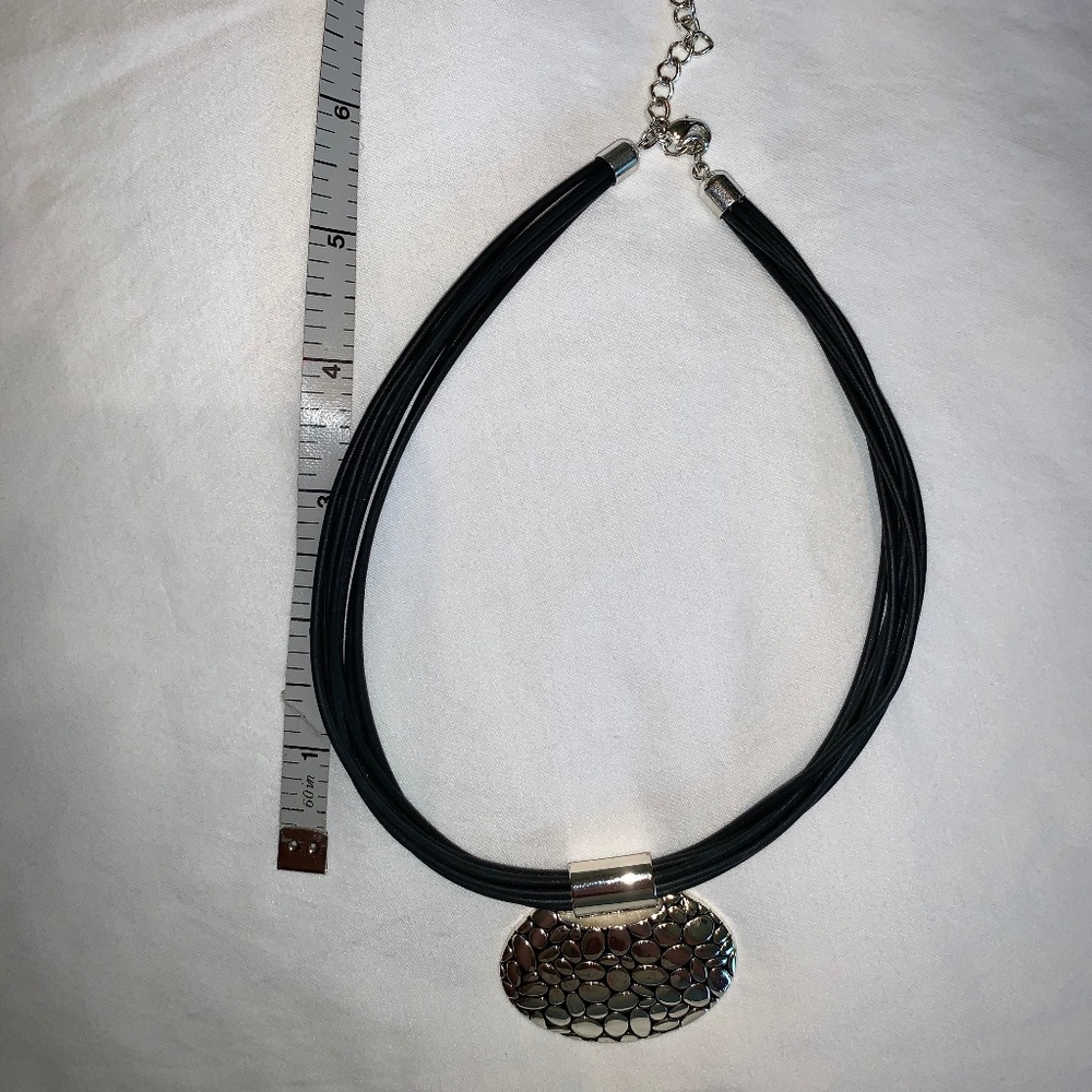 Silver pendant on Black faux leather necklace